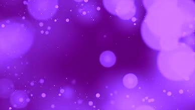 4K紫色梦幻唯美粒子光斑字幕背景视频的预览图